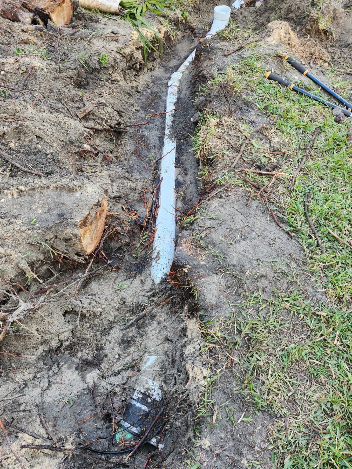 New PVC set with proper slope to restore dependable flow.